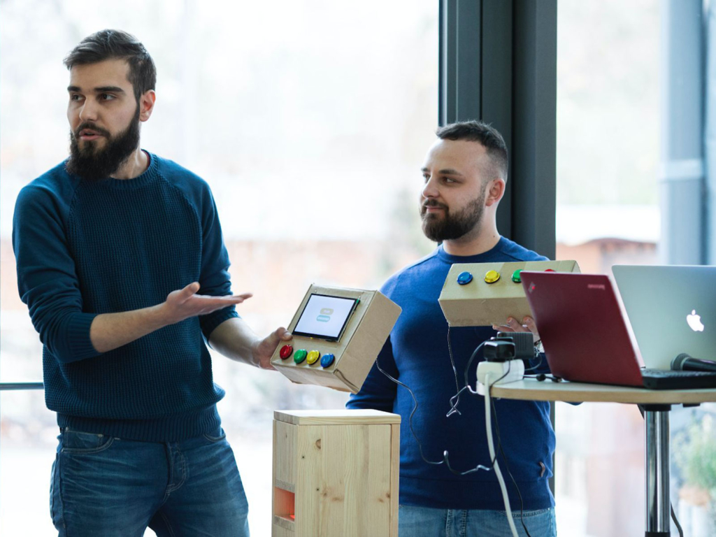 Team Monkey See, Monkey Do presenting their prototypes